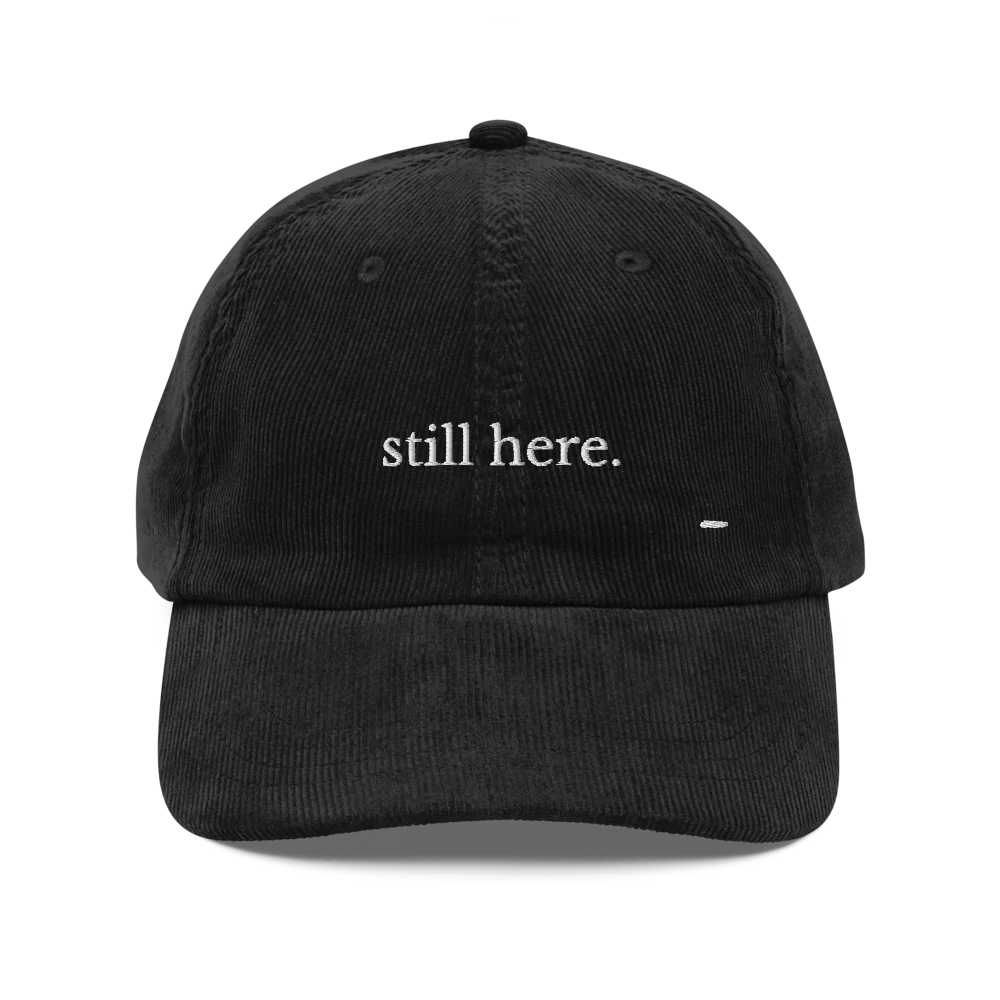 still here. corduroy cap